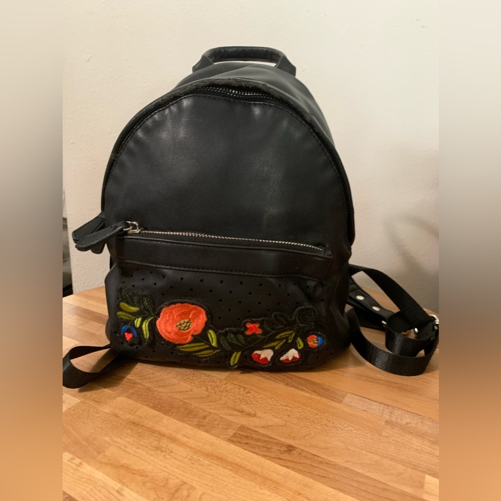 Dream control faux leather with embroidered floral pattern on front and straps🌹